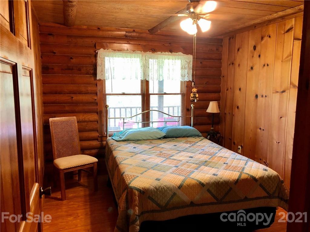373 North Burris Road Sharon, SC 29742 - Photo 10 of 36 a bedroom with a bed and a chandelier