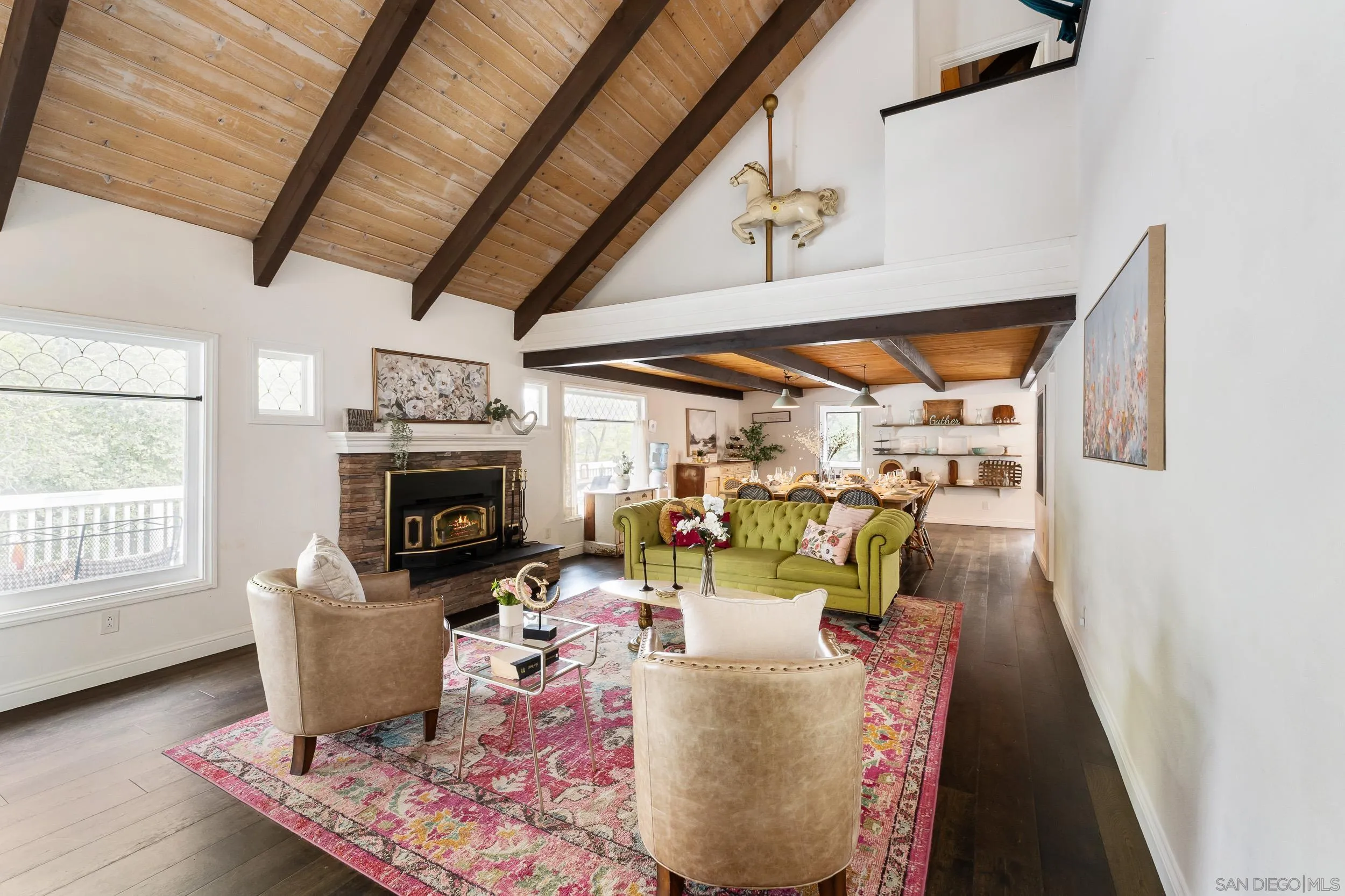 3517 Deer Lake Park Road Julian, CA 92036 - Photo 3 of 75 a dining room with furniture a fireplace and wooden floor