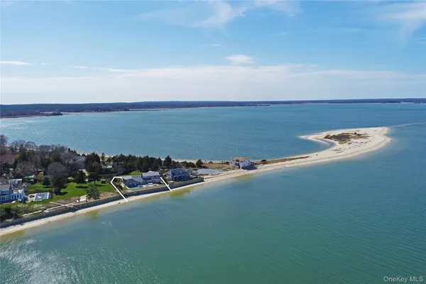 a view of a large body of water with lots of buildings in the background