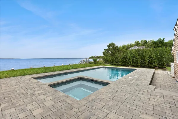 a view of swimming pool with a yard