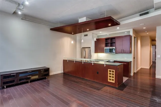 a kitchen with stainless steel appliances granite countertop a stove and a sink