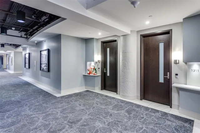 a view of a hallway with wooden shelves