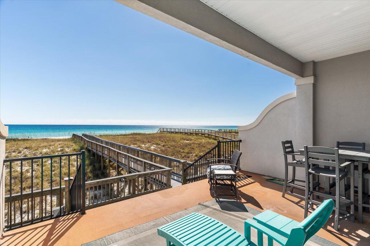 7923 Gulf Boulevard Navarre, FL 32566 - Photo 14 of 33 a view of a balcony with chairs