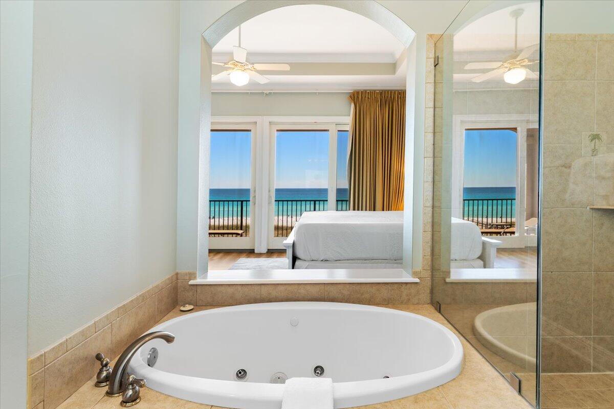 7923 Gulf Boulevard Navarre, FL 32566 - Photo 8 of 33 a bathroom with a tub and sink