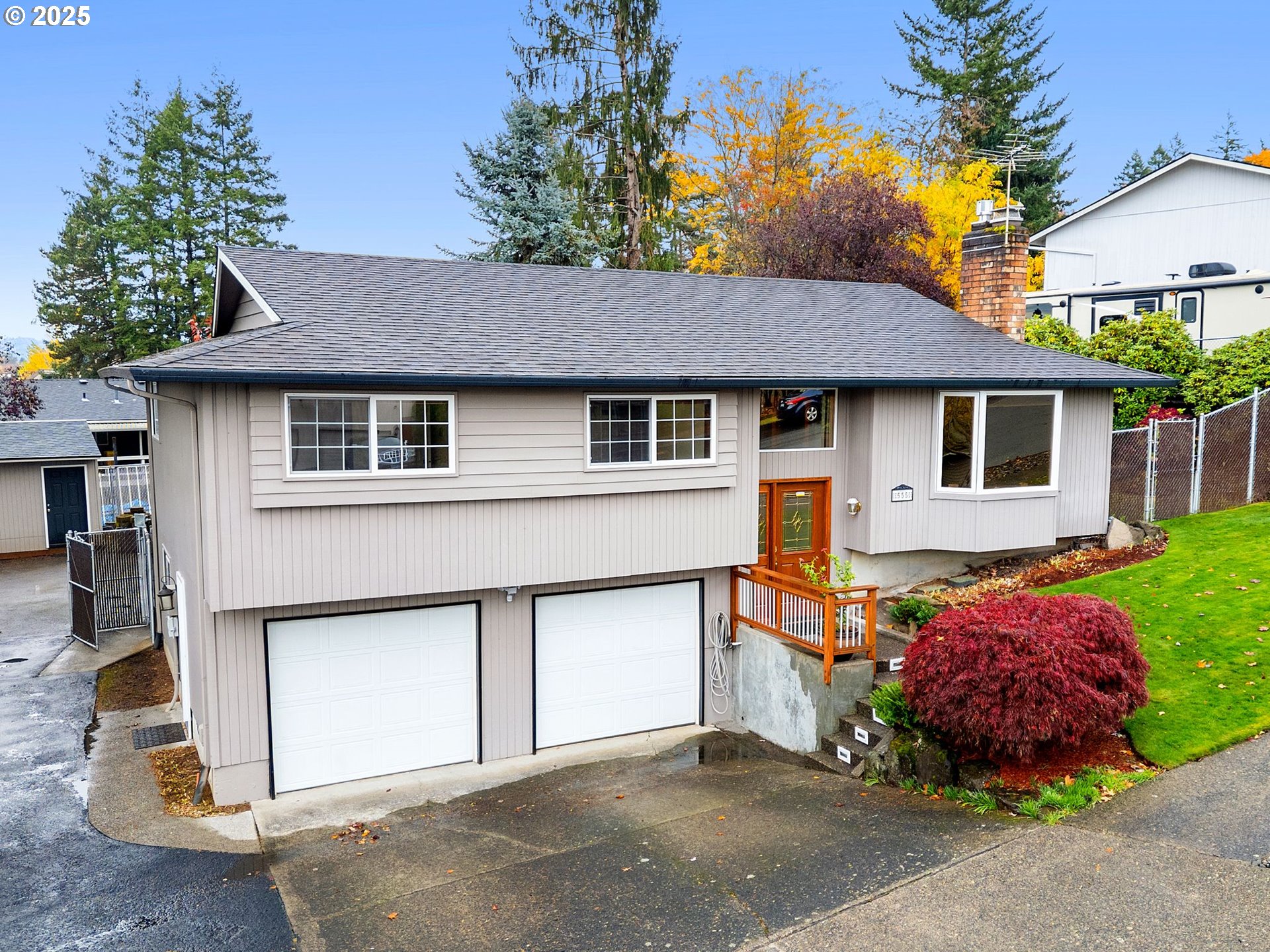 555 Southwest 7th Street Gresham, OR 97080 - Photo 1 of 48 a house that has a lot of windows and plants