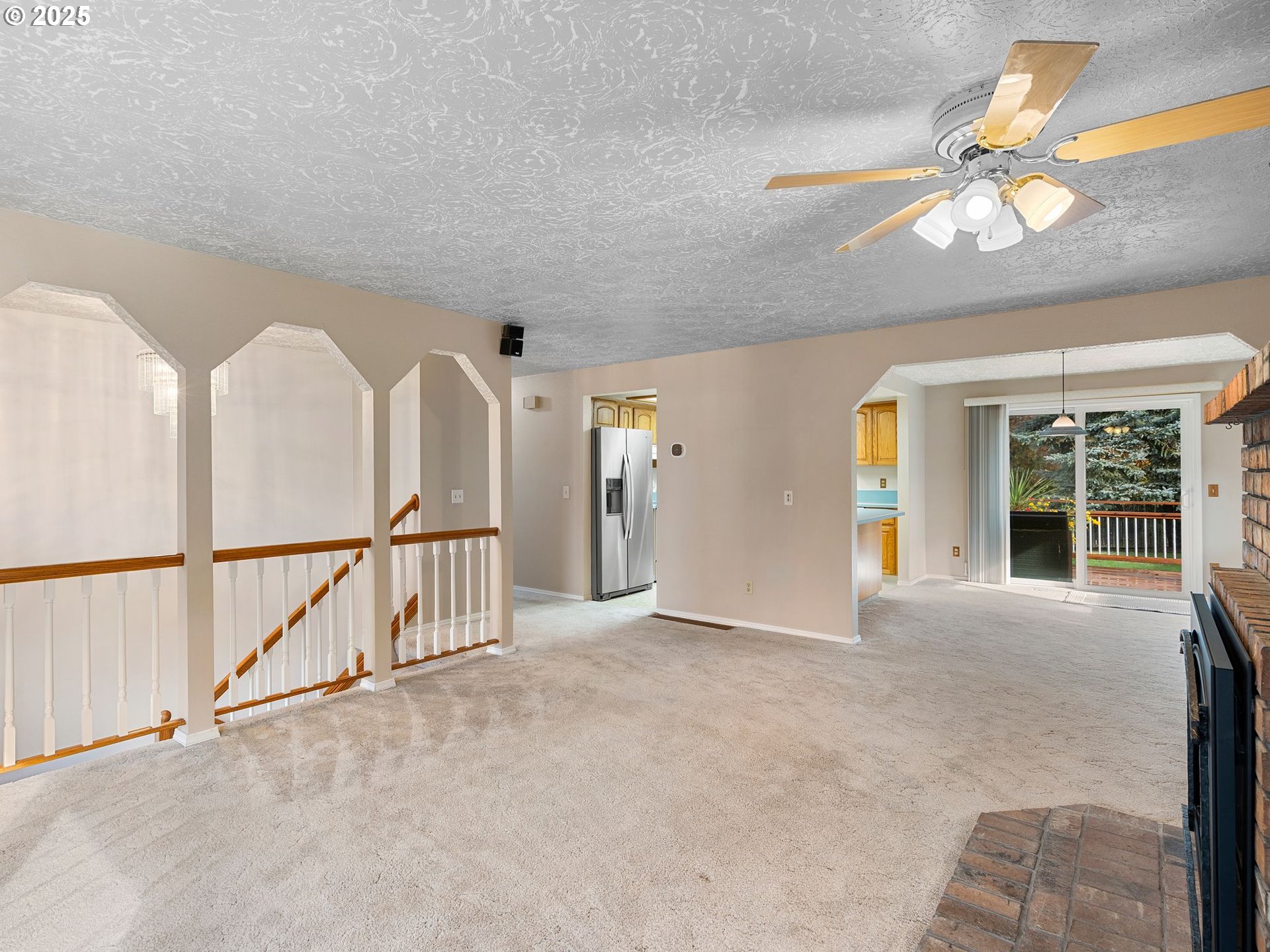555 Southwest 7th Street Gresham, OR 97080 - Photo 12 of 48 a view of an empty room with chandelier fan