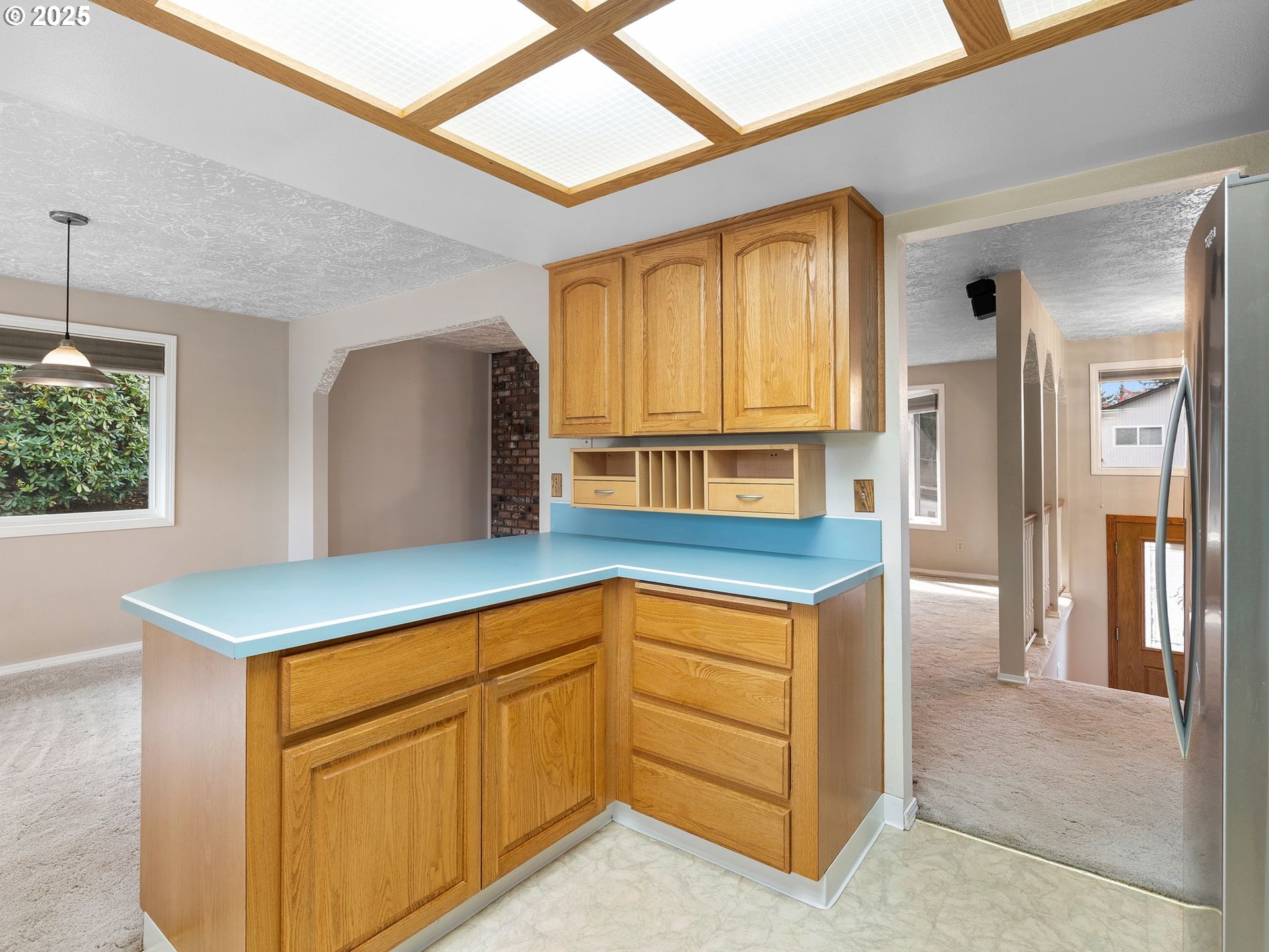 555 Southwest 7th Street Gresham, OR 97080 - Photo 15 of 48 a kitchen with stainless steel appliances granite countertop a refrigerator and a stove