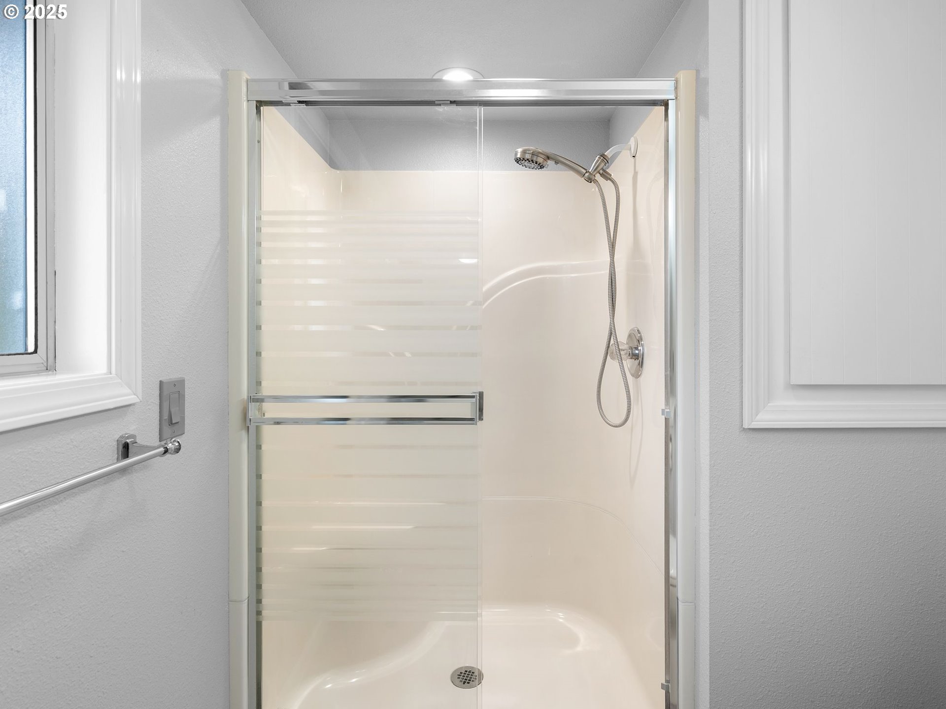 555 Southwest 7th Street Gresham, OR 97080 - Photo 22 of 48 a bathroom with a glass shower door
