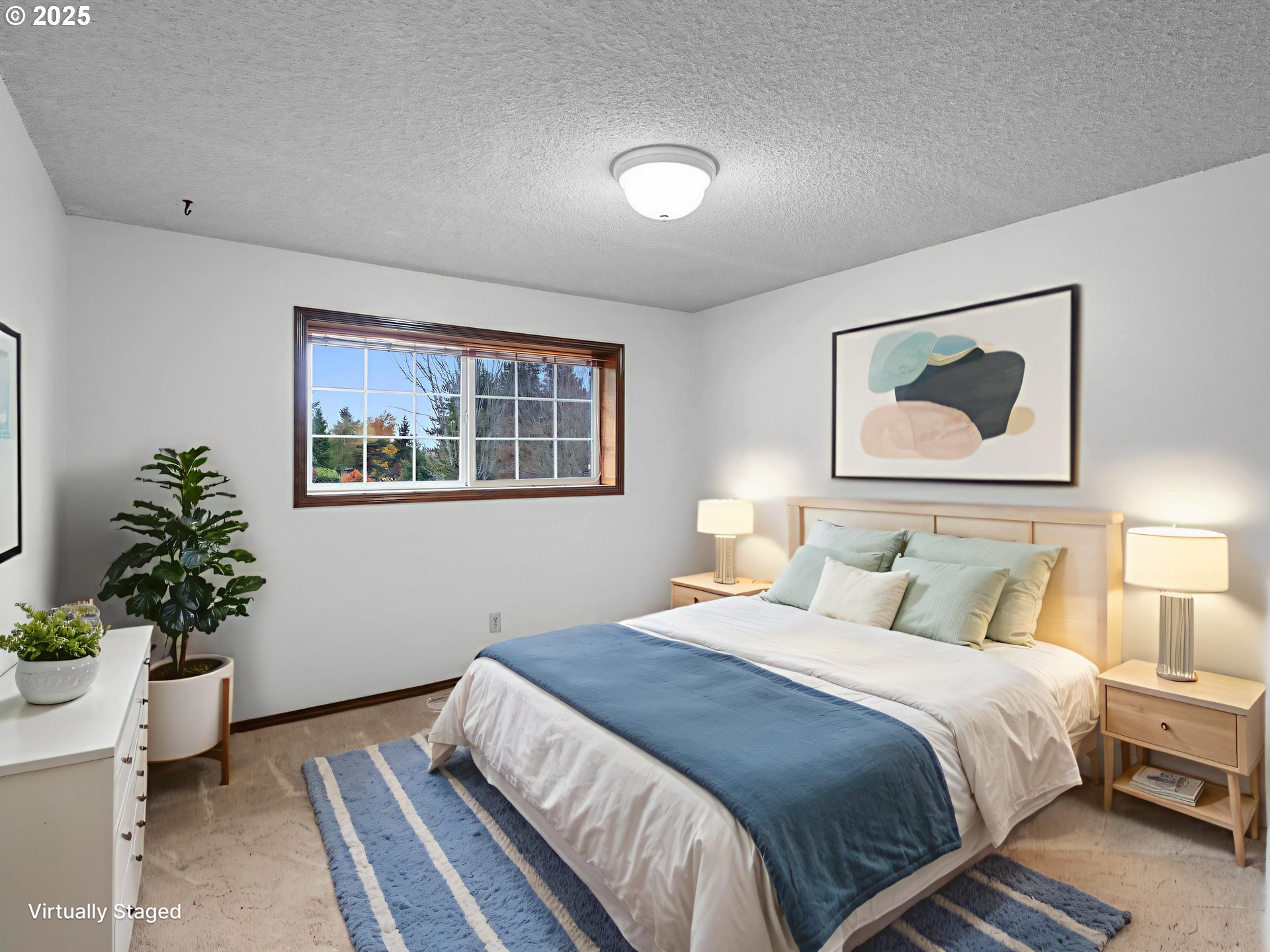 555 Southwest 7th Street Gresham, OR 97080 - Photo 23 of 48 a bedroom with a bed and a potted plant