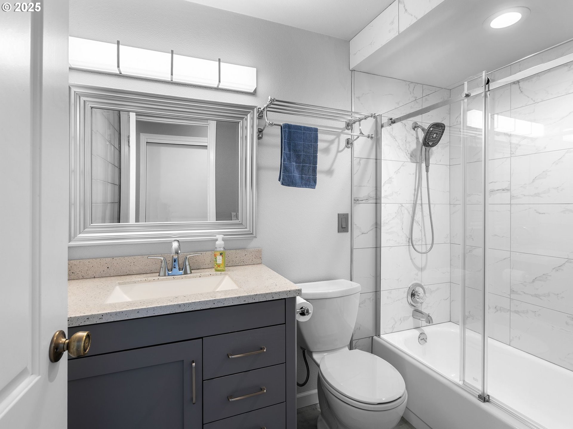 555 Southwest 7th Street Gresham, OR 97080 - Photo 25 of 48 a bathroom with a sink a toilet and shower