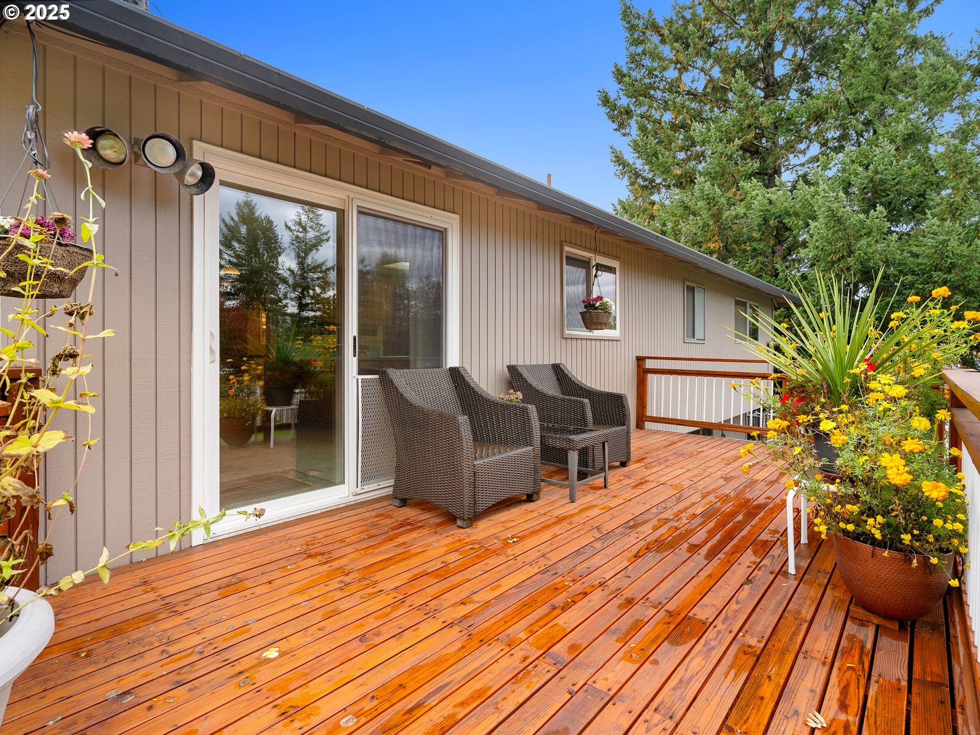 555 Southwest 7th Street Gresham, OR 97080 - Photo 40 of 48 a roof deck with table and chairs and wooden floor
