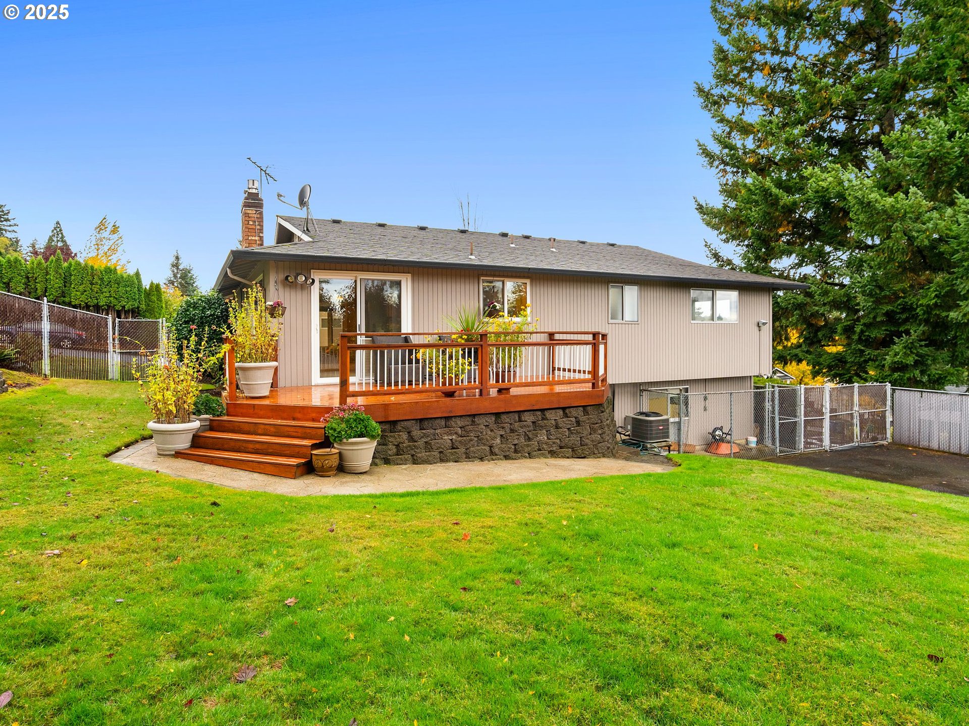 555 Southwest 7th Street Gresham, OR 97080 - Photo 5 of 48 a view of a house with a yard and sitting area
