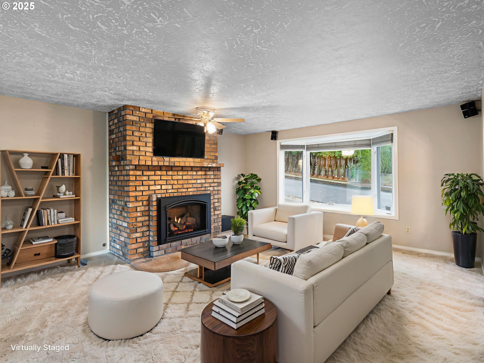 555 Southwest 7th Street Gresham, OR 97080 - Photo 8 of 48 a living room with furniture a flat screen tv and a fireplace