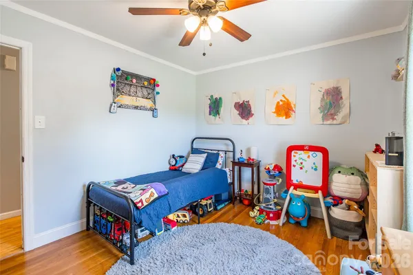a bedroom with toys and a bed
