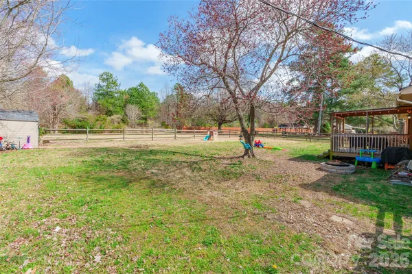 a view of park with large trees
