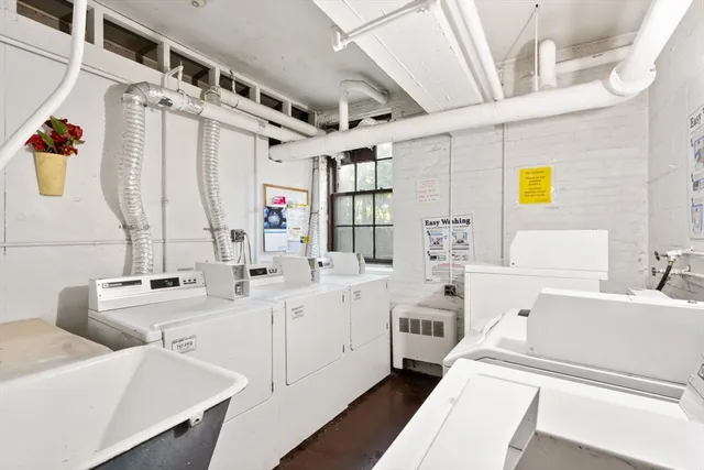 a bathroom with a double vanity sink and mirror