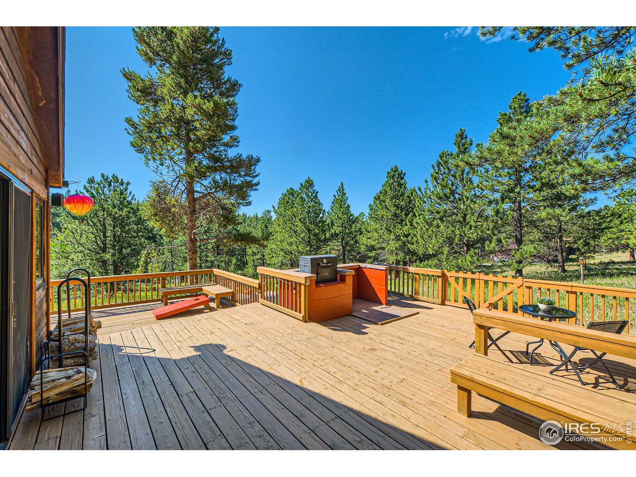 113 Bramer Road Ward, CO 80481 - Photo 8 of 32 Plenty of space for soaking in the mountain sun on the 922 SF deck!