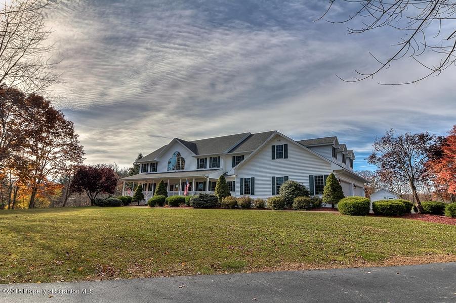 360 Upper Demunds Road Dallas, PA 18612 - Photo 1 of 40 a front view of house with yard and green space