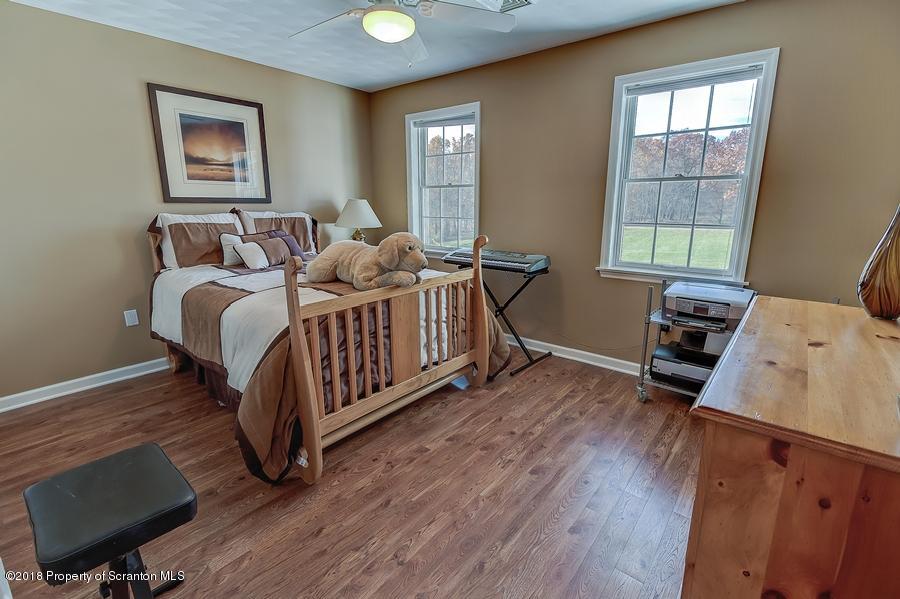 360 Upper Demunds Road Dallas, PA 18612 - Photo 24 of 40 a bedroom with a bed and a window