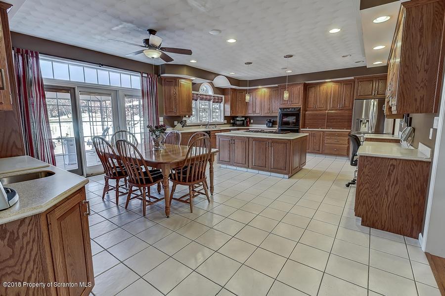 360 Upper Demunds Road Dallas, PA 18612 - Photo 4 of 40 a view of a dining room with furniture