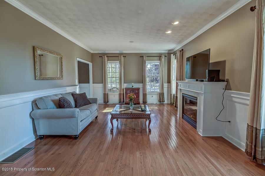 360 Upper Demunds Road Dallas, PA 18612 - Photo 7 of 40 a living room with furniture and a flat screen tv