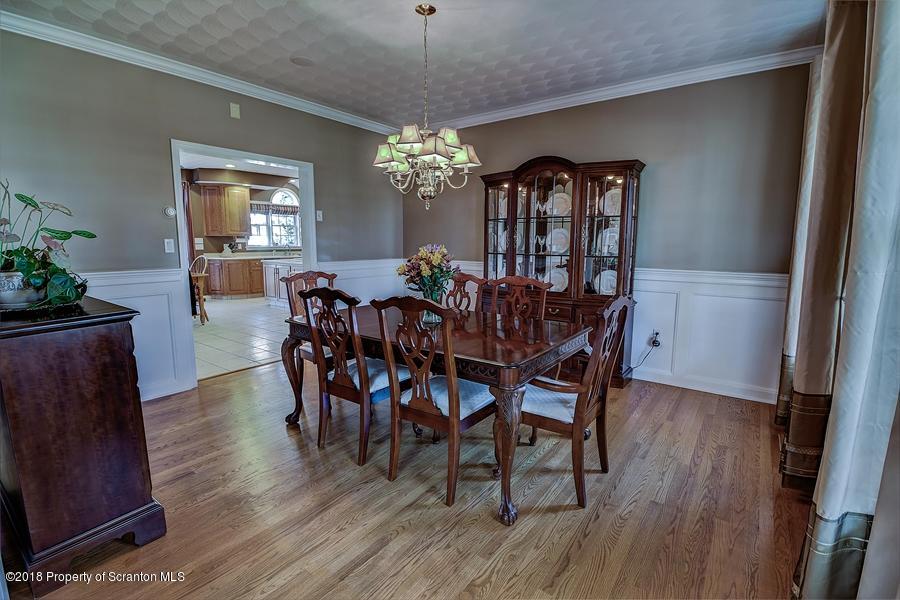 360 Upper Demunds Road Dallas, PA 18612 - Photo 9 of 40 a view of a dining room with furniture window and wooden floor