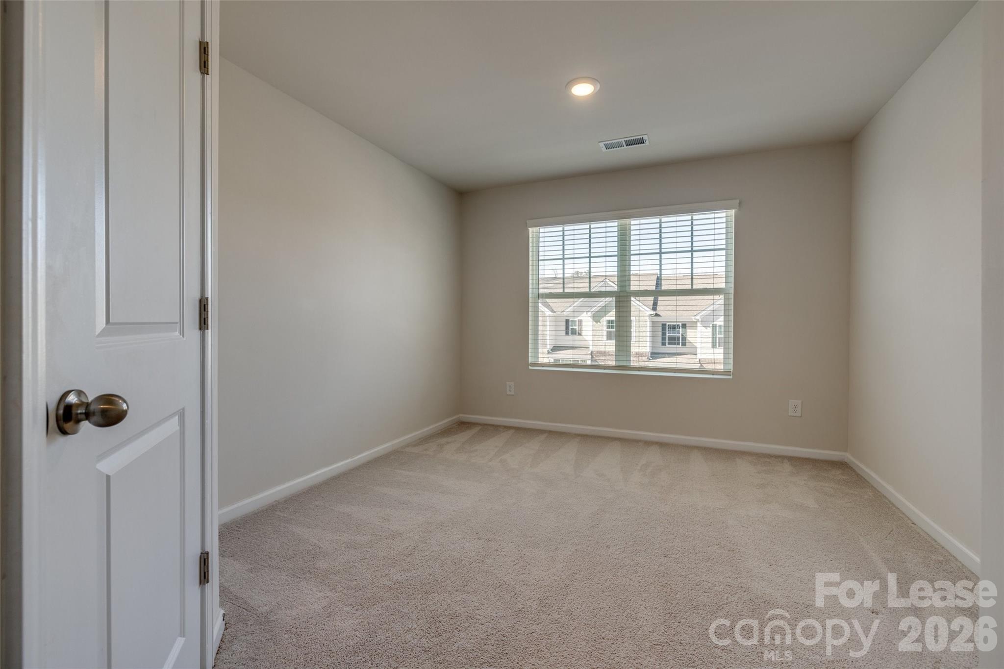 807 Gable Oak Lane Fort Mill, SC 29708 - Photo 25 of 39 a view of an empty room with a window