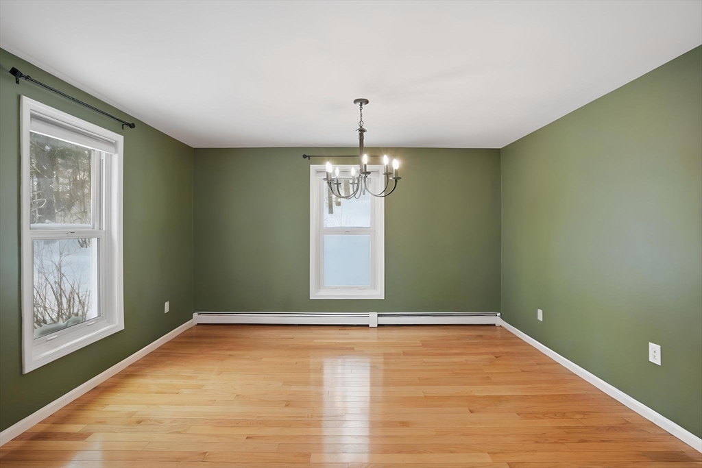 66 Buttonwood Avenue Sutton, MA 01590 - Photo 19 of 42 a view of an empty room with window and wooden floor