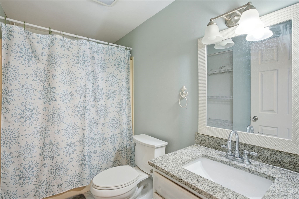 66 Buttonwood Avenue Sutton, MA 01590 - Photo 29 of 42 a bathroom with a granite countertop sink toilet and shower