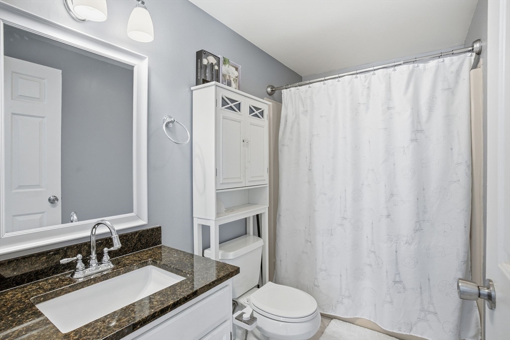 66 Buttonwood Avenue Sutton, MA 01590 - Photo 32 of 42 a bathroom with a granite countertop sink toilet and shower