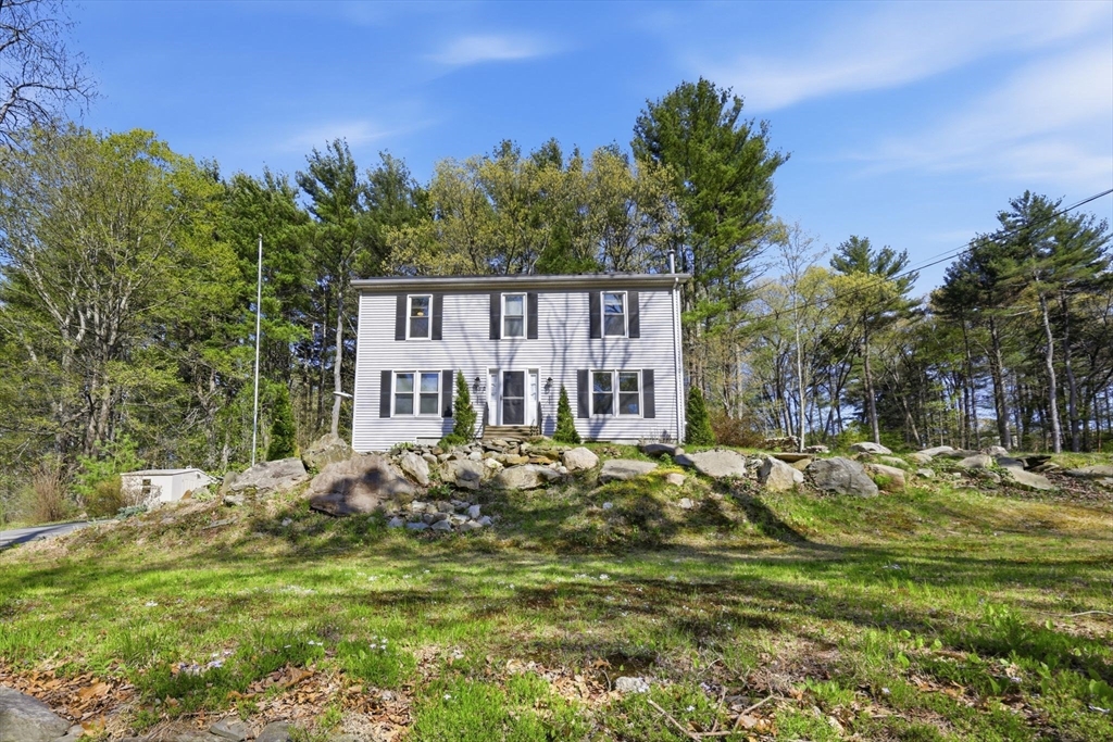 66 Buttonwood Avenue Sutton, MA 01590 - Photo 8 of 42 a house view with a garden space