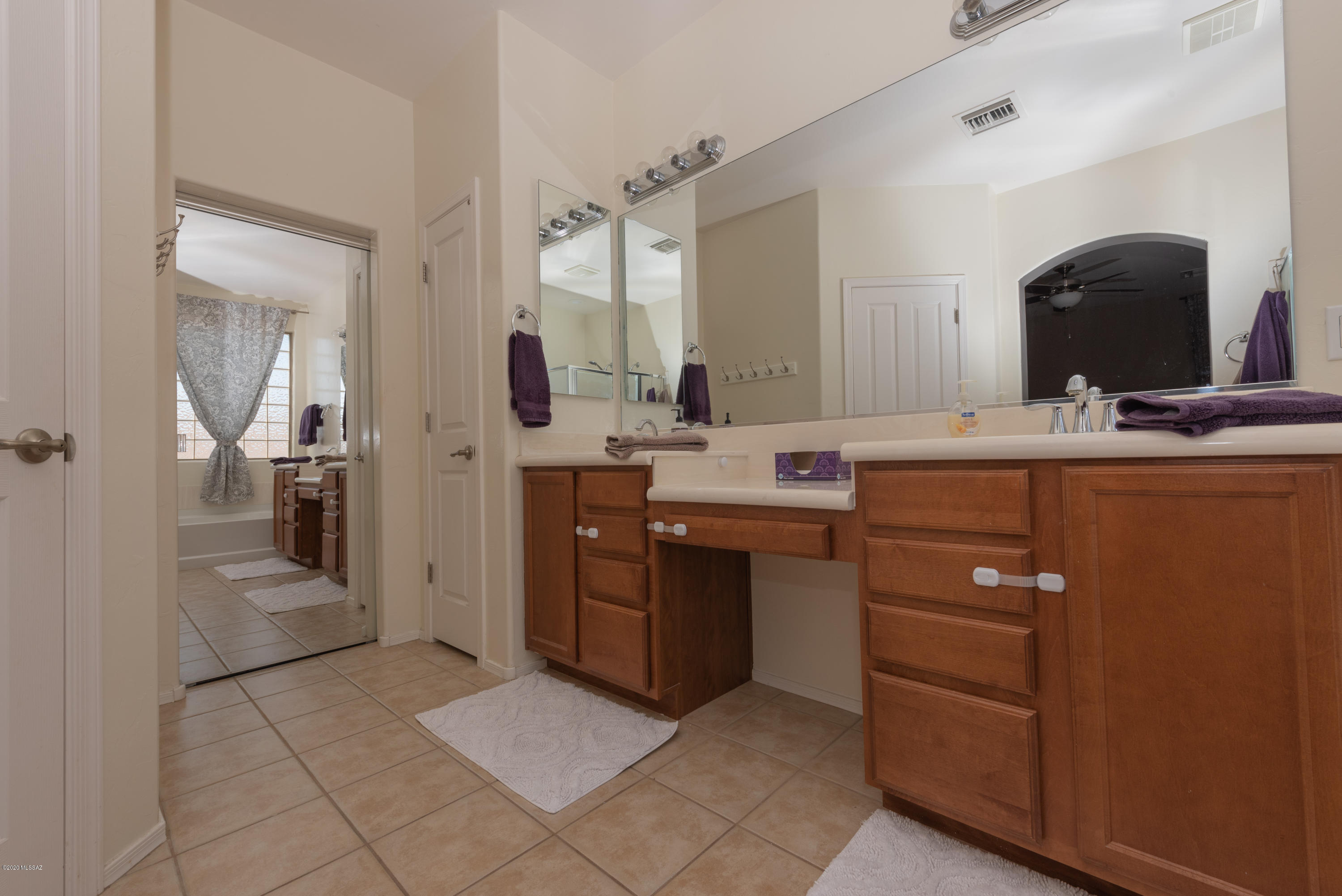 12910 Bloomington Loop Oro Valley, AZ 85755 - Photo 21 of 30 a room with a sink and a mirror
