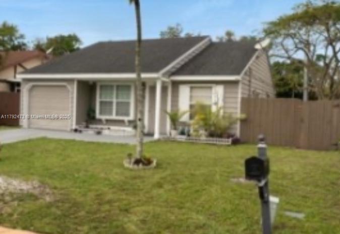 11233 Model Circle West Boca Raton, FL 33428 - Photo 12 of 13 a front view of a house with garden