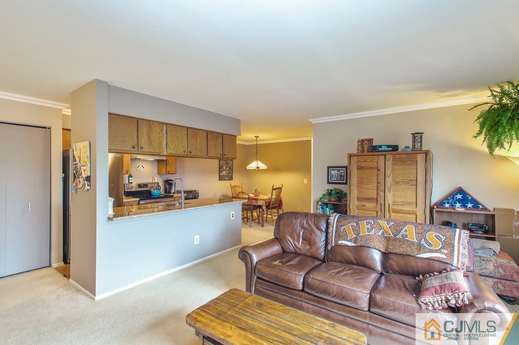 52 Bolton Court Somerset, NJ 08873 - Photo 11 of 18 a living room with furniture and a kitchen