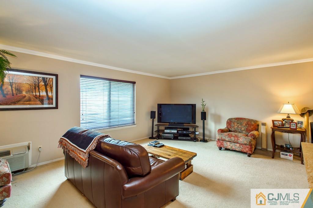 52 Bolton Court Somerset, NJ 08873 - Photo 10 of 18 a living room with furniture and a flat screen tv