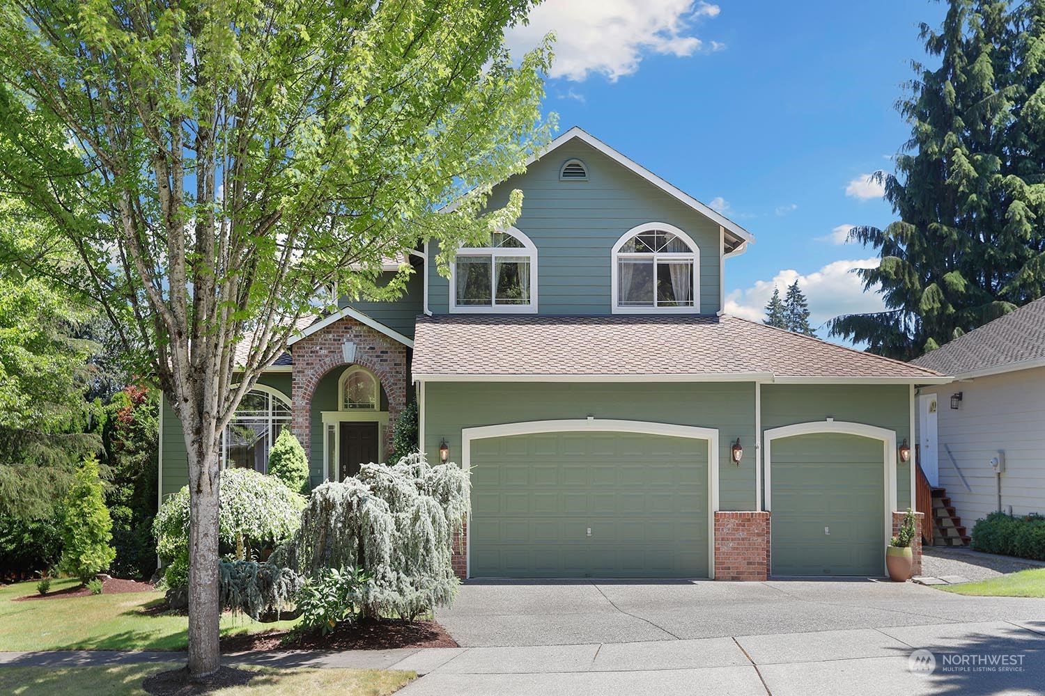 23509 25th Drive Southeast Bothell, WA 98021 - Photo 1 of 39 a front view of a house with garden