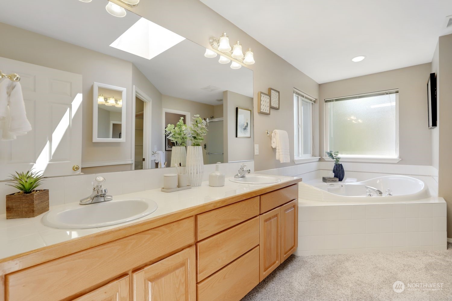 23509 25th Drive Southeast Bothell, WA 98021 - Photo 25 of 39 a bathroom with a sink double vanity granite and a mirror