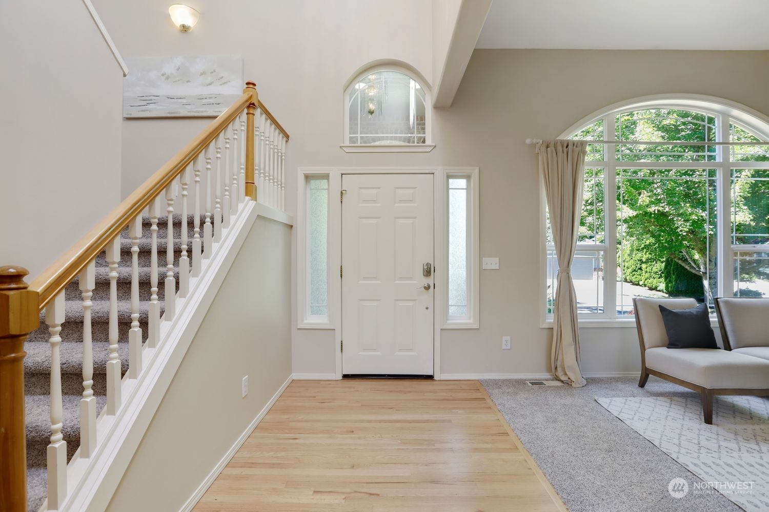 23509 25th Drive Southeast Bothell, WA 98021 - Photo 4 of 39 a view of staircase with white walls and wooden floor