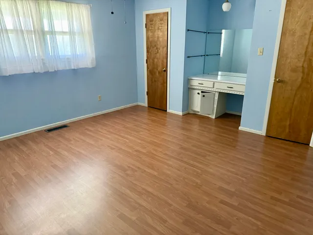 a kitchen with a stove and cabinets