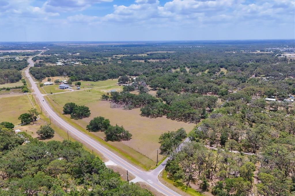 6720 Jim Davis Road Parrish, FL 34219 - Photo 5 of 16 an aerial view of lake and residential houses with outdoor space