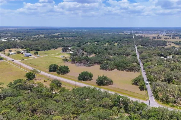 a view of a lake with a yard
