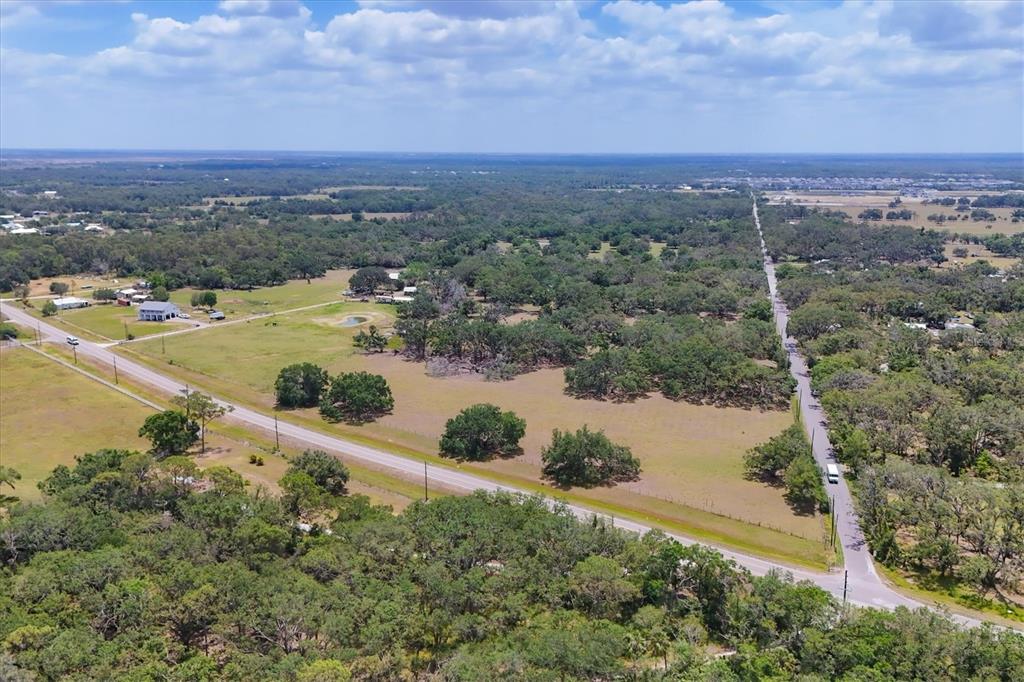 6720 Jim Davis Road Parrish, FL 34219 - Photo 6 of 16 a view of a lake with mountains in the background