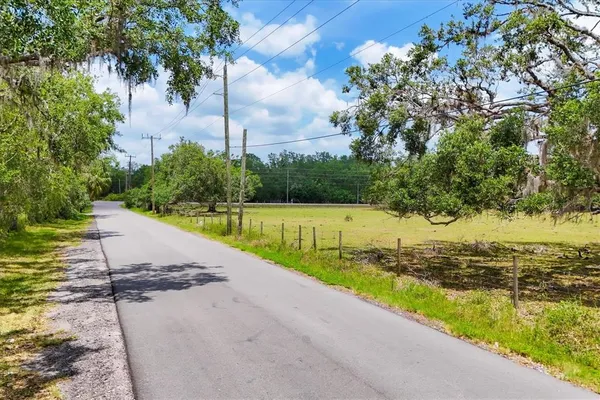 a view of a lake with beach and city view