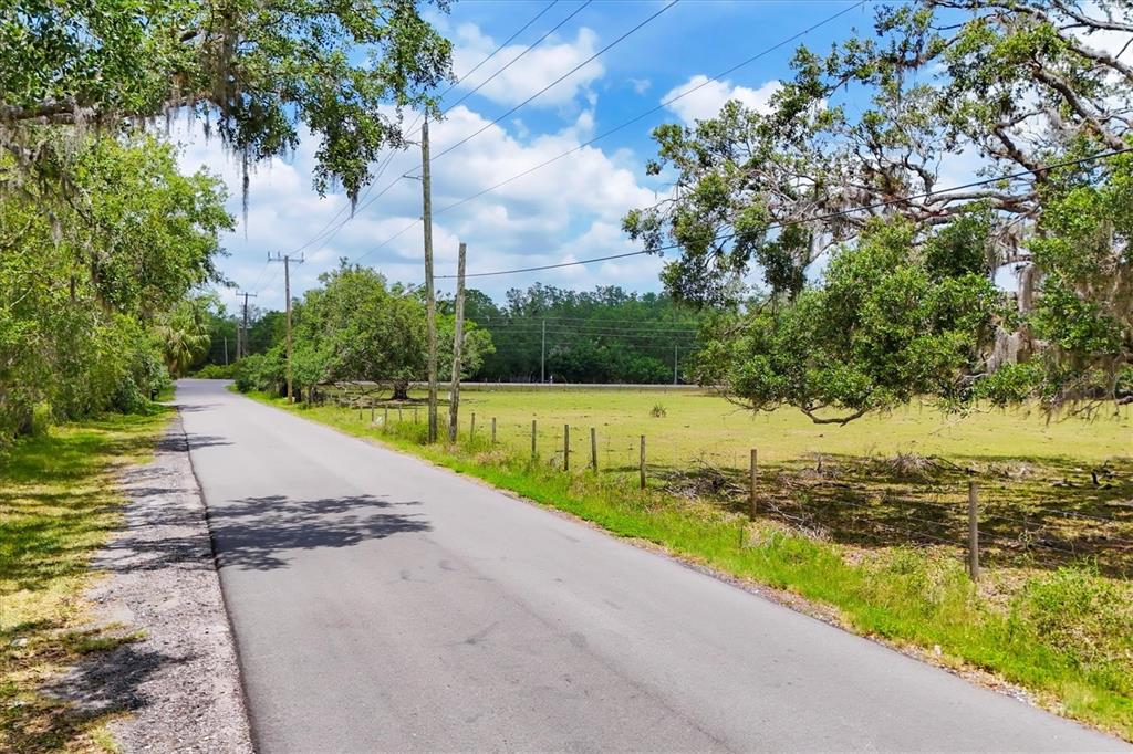 6720 Jim Davis Road Parrish, FL 34219 - Photo 10 of 16 a view of a lake with a park