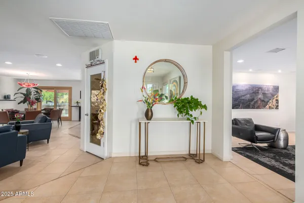 a living room with furniture and a potted plant
