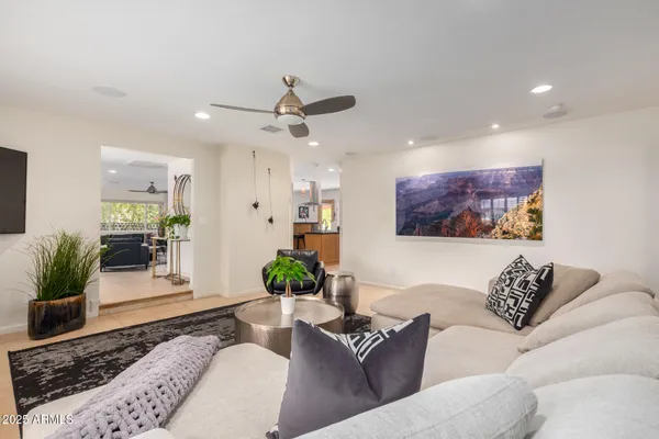 a living room with furniture and a large window