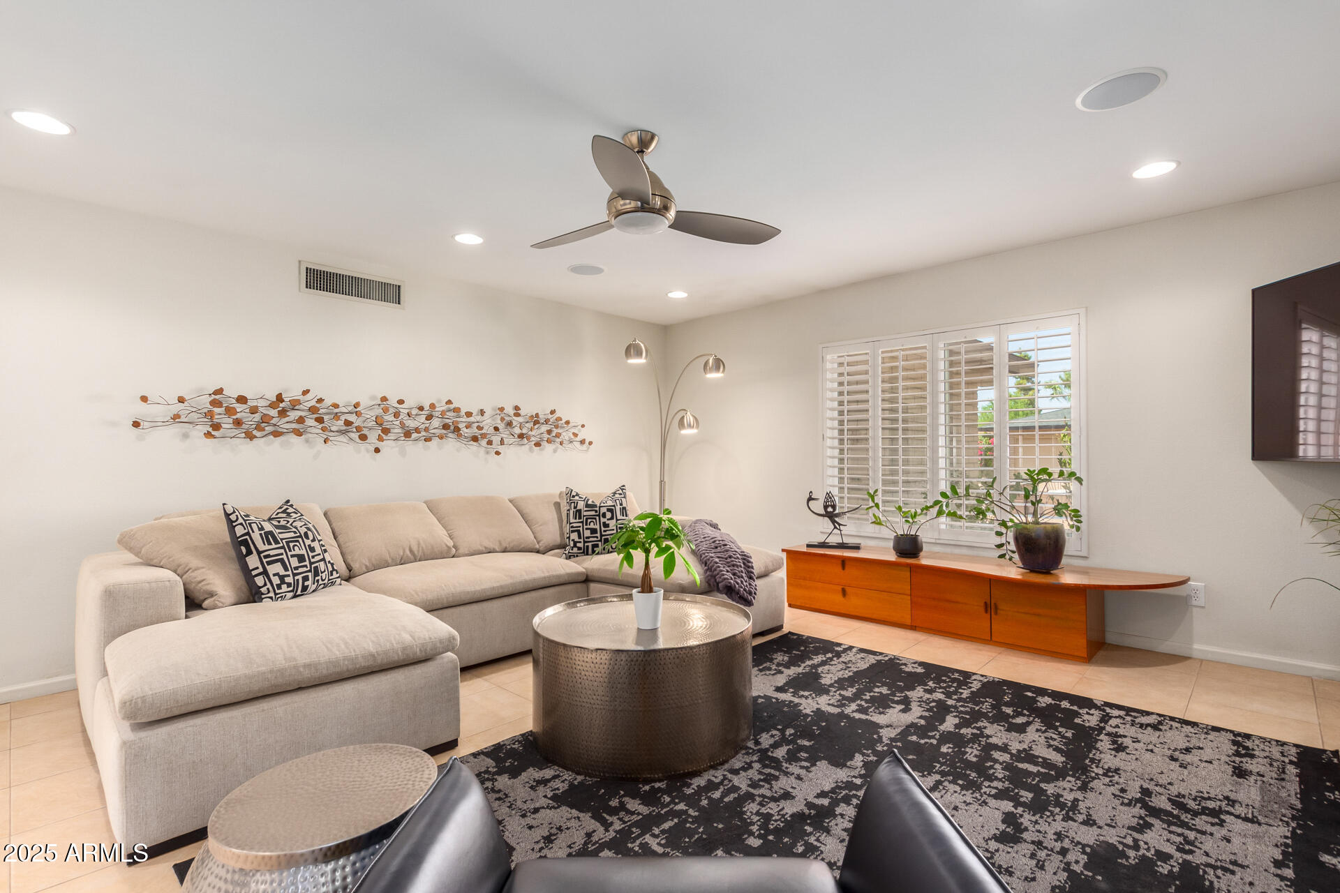 2909 East Las Rocas Drive Phoenix, AZ 85028 - Photo 15 of 48 a living room with furniture and a large window