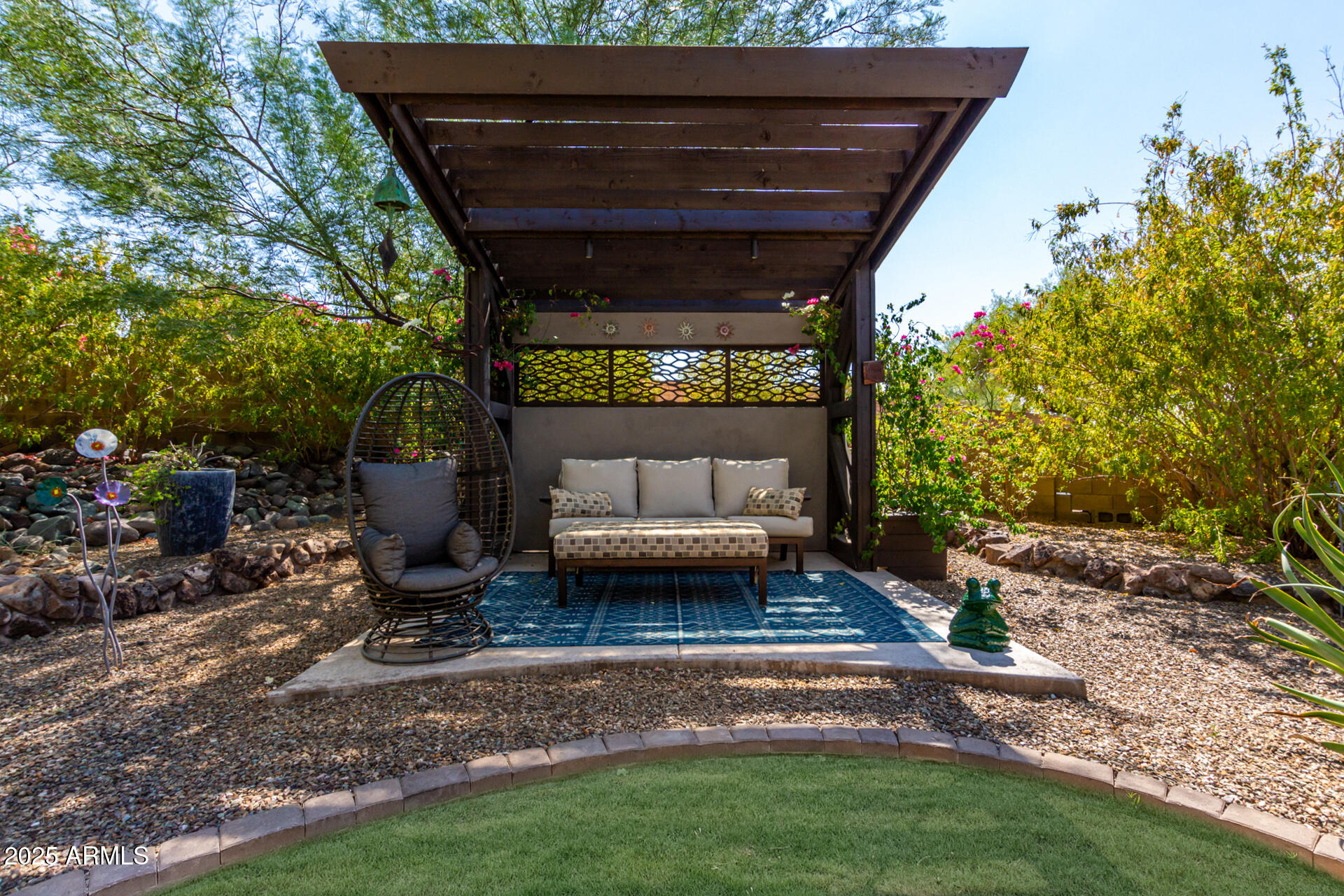 2909 East Las Rocas Drive Phoenix, AZ 85028 - Photo 2 of 48 a view of patio with a table and chairs and potted plants