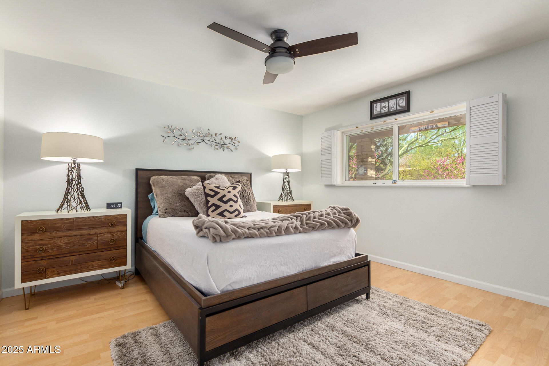 2909 East Las Rocas Drive Phoenix, AZ 85028 - Photo 22 of 48 a bed room with a bed and a night stand