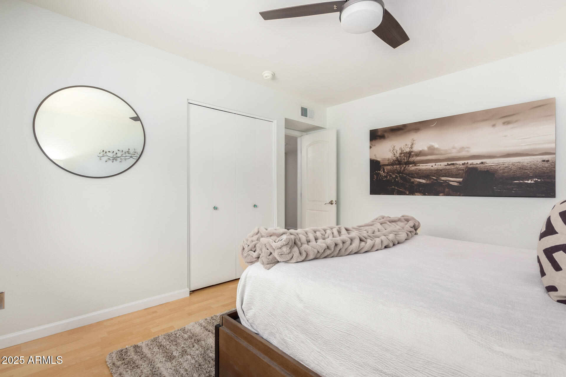 2909 East Las Rocas Drive Phoenix, AZ 85028 - Photo 23 of 48 a bedroom with a bed and a chandelier